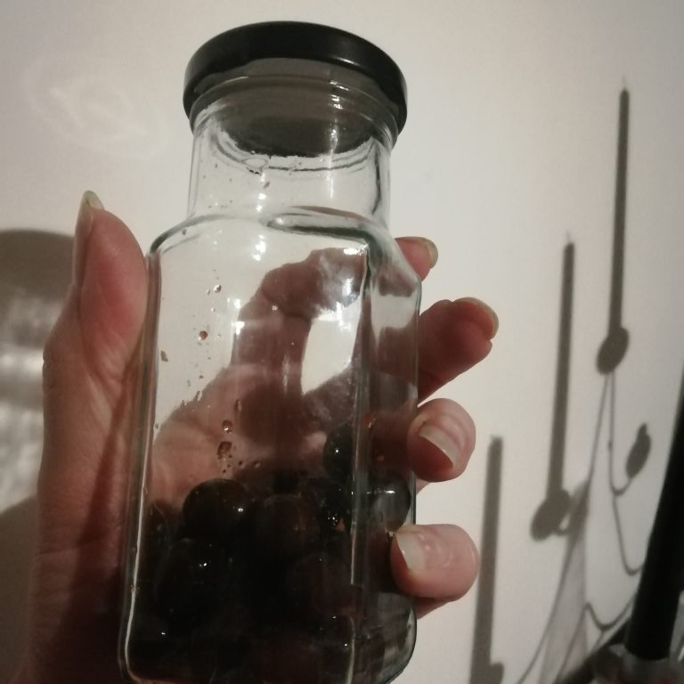 Sloes in a small batch jar